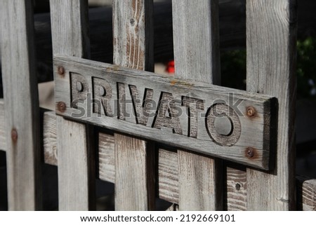"private" writing on wooden gate, mountain.