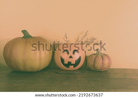 a plastic Jack-O-Lantern with pumpkin .