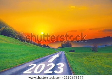 Open empty road path end and new year 2023. Upcoming 2023 goals and leaving behind 2022 year. passing time future, life plan change, work start run line, sunset hope growth begin, go forward concept. Royalty-Free Stock Photo #2192678177