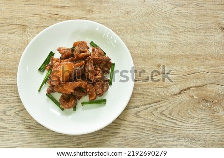 fried fermenting beef meat with pandan leaf on plate Royalty-Free Stock Photo #2192690279