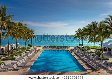 Tropical paradise: caribbean beach with pool, gazebos and palm trees, Montego Bay, Jamaica Royalty-Free Stock Photo #2192709775