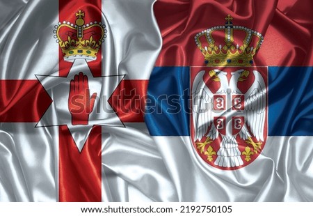 Northern Ireland and Serbia two folded silk flags together.