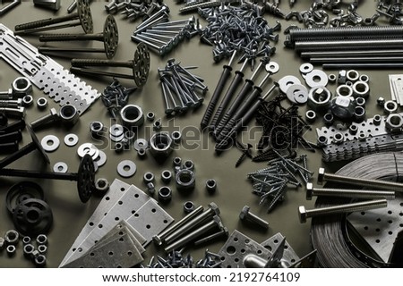 Set of bolts nuts nails metal fasteners. Consumable hardware tools. assortment steel screws collection close up background Royalty-Free Stock Photo #2192764109
