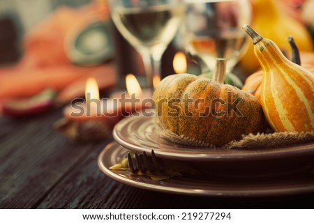 Autumn table setting with pumpkins.  Thanksgiving dinner and autumn decoration.
