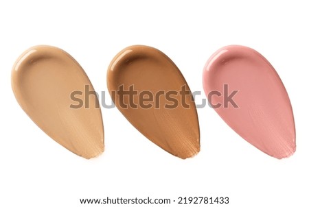 Shades of liquid foundation smears isolated on white background. Samples of liquid foundation for your design. Royalty-Free Stock Photo #2192781433
