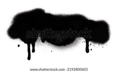 Black color spray paint or graffiti design element on the white wall background. Royalty-Free Stock Photo #2192800601