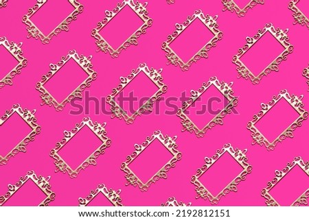 Golden ornate frames, creative pattern on neon pink background.