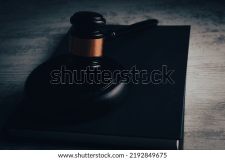 judge gavel with book on wooden background