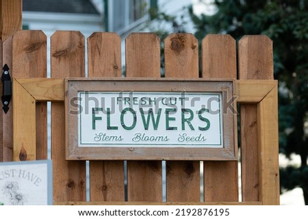 Fresh cut flowers sign on wooden boards