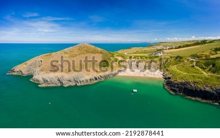Panoramic aerial view of a beautiful sandy beach and headland (Mwnt, Ceredigion, West Wales) Royalty-Free Stock Photo #2192878441