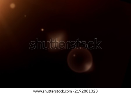 sun lens flare light over black background.
Sun flash with rays and spotlight