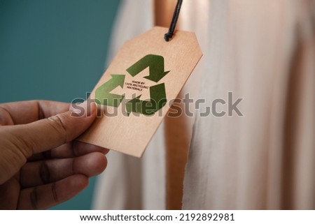 Recycling Products Concept. Organic Cotton Recycling Cloth. Zero Waste Materials. Environment Care, Reuse, Renewable for Sustainable Lifestyle. Recycle Icon show on Tag Royalty-Free Stock Photo #2192892981