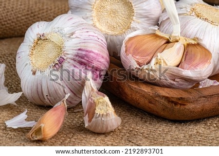 Slices and Whole bulb of garlic close up. Selective forus.