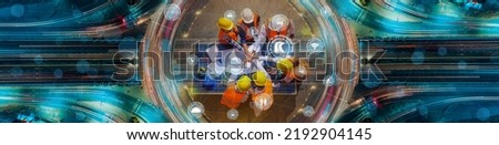 Architect engineers putting their hands together on solar panel with Social infrastructure icons. Social traffic infrastructure and intelligent communication technology concept. Royalty-Free Stock Photo #2192904145