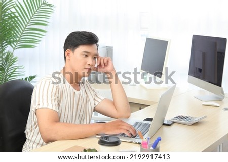 Portrait photo of a young handsome Asian adult man, livestream to sell goods online, concept of personal commerce reseller business of digital life 
