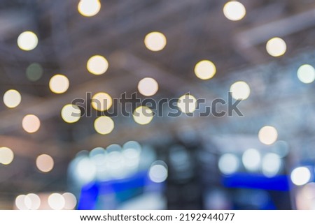 Event trade show expo background. Abstract blurred shopping mal- bokeh lights. Expo business- booth stand Royalty-Free Stock Photo #2192944077