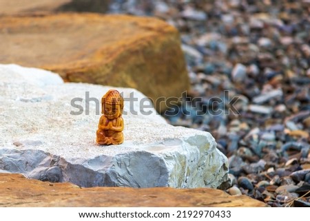 Buddha on a rock. Сoncept of calmness and relaxation. Meditation and health