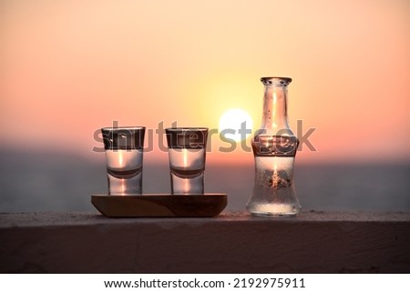 Drinking tsikoudia, the traditional drink in cretan cuisine  Royalty-Free Stock Photo #2192975911