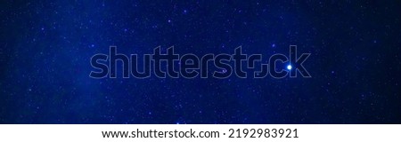 tellar Milky Way at night with stars. Panorama of the dark blue starry sky