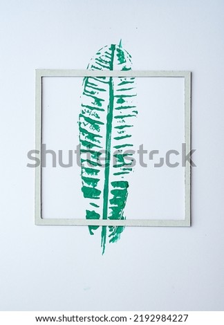 Modern splash frame on white background, acrylic paint on leave.