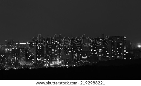 Illumination of the windows of the night city with residential multi-storey buildings, time lapse Royalty-Free Stock Photo #2192988221