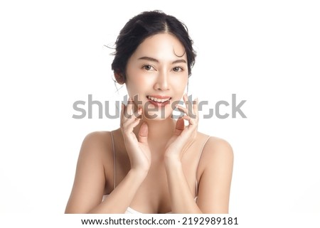 Asian woman with a beautiful face and Perfect clean fresh skin. Cute female model with natural makeup and sparkling eyes on white isolated background. Facial treatment, Cosmetology, beauty Concept. Royalty-Free Stock Photo #2192989181