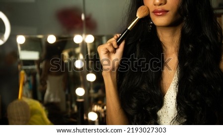 Woman use cosmetic over make up table