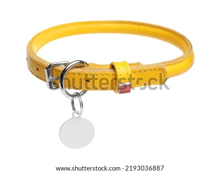 Yellow leather dog collar with tag isolated on white Royalty-Free Stock Photo #2193036887