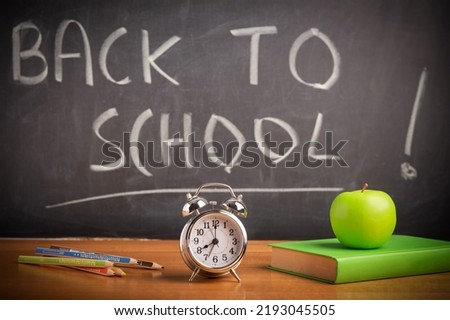 Back to school theme using school supplies and blackboard. School Time

