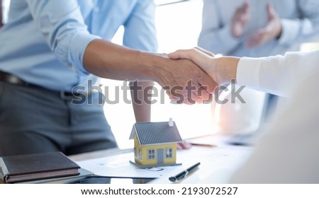 Real estate agent or realtor handshake with client after the deal, business people. handshake Successful business concept.