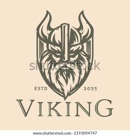 Norse viking logo design. Nordic warrior shield symbol. Horned Norseman emblem. Odin horn helmet and beard. Brand identity vector illustration. Royalty-Free Stock Photo #2193094747