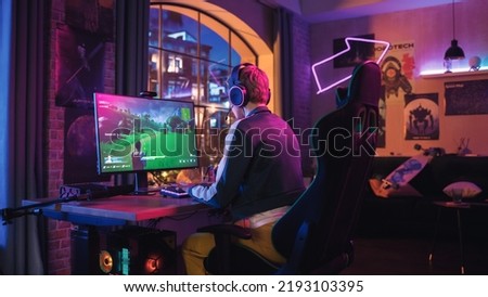 Gaming at Home: Attractive Female Gamer Playing Online Video Game on Personal Computer. Professional Stylish Female Player Enjoying 3D Shooter with Arcade Online Multiplayer PvP Battle on Screen.