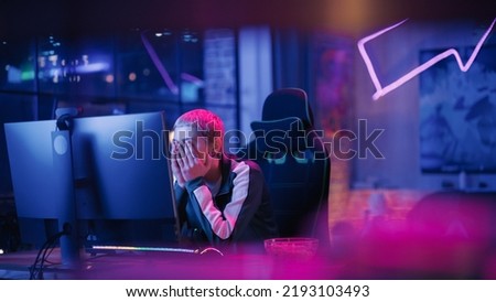Frustrated Female Gamer Losing in Online Video Game on Computer. Portrait of Young Stylish Woman in Headphones Playing PvP Tournament with Other Players, Talking with Team on Microphone.