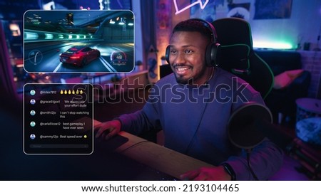 Excited African American Streamer Playing a Racing Video Game. Man Streaming His Gaming Progress from Home in Living Room Apartment. Followers Engaging Through Interface, Live Broadcast on Internet Royalty-Free Stock Photo #2193104465