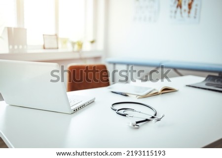 Professional doctor's office interior with medical equipment, medicine and healthcare concept. Doctor's office during the day. Empty Doctor's Office
