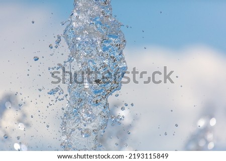 Splashes of water in a fountain as an abstract background.