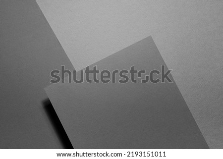 Carbon grey abstract geometric background with fly inclined rectangle surface in hard light, shadows in rich minimal business style for card, poster, flyer, text, top view.