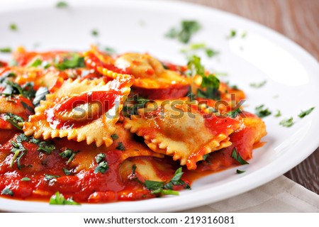 Ravioli with tomato sauce Royalty-Free Stock Photo #219316081