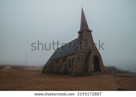Church on a Cliff. church in the morning mist. Old Abandoned Church in the Fog.  Royalty-Free Stock Photo #2193172887