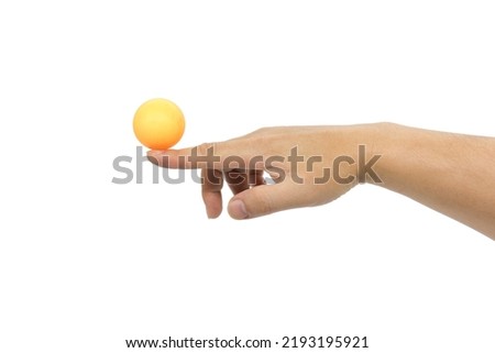 One finger touching an orange ping pong ball, isolated on white background Royalty-Free Stock Photo #2193195921