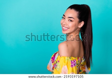 Profile photo of optimistic millennial tail hairstyle lady near promo wear floral top isolated on turquoise color background Royalty-Free Stock Photo #2193197105