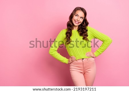 Photo of attractive girl curly hairstyle banner look empty space dressed trendy green knitwear pullover isolated on pink color background