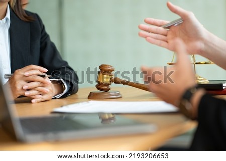 business law concept lawyer business Consultation between male lawyers and business clients The company provides tax and legal services and discusses contract documents between male lawyers  Royalty-Free Stock Photo #2193206653