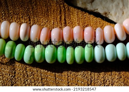 Natural pink, blue and green opal beads. Pink and blue opal have a natural color, green opal is artificially colored.
