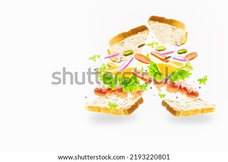 Two sandwiches with meat, cheese, vegetables in a frozen flight on a light background. Minimalism. Abstraction. Fast food, vitamins. Restaurant, hotel, cafe. Advertising, banner.