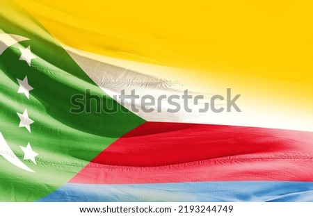 Comoros national flag cloth fabric waving.