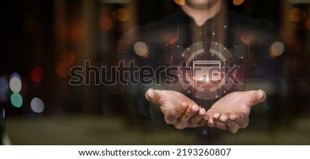 Business man holding a virtual card on a virtual computer screen.