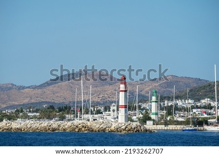 Red and green lighthouses at entrance to D-Marin (Dmarin) Turgutreis. Flagship marina is located near Bodrum and features award-winning marina village and heliport, Turkey.