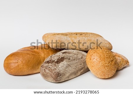 Homemade natural breads. Different kinds of fresh bread as background, perspective view with copy space.
