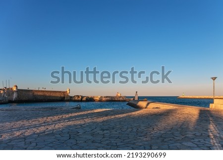 Praia da Batata towards the harbor entrance in sunset time, Lagos, The Algarve, Portugal 